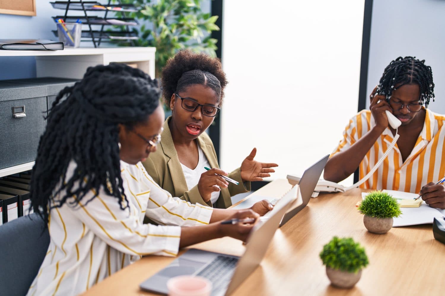 SolMerge team collaborating around a desk